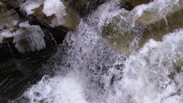 Wild Mountain River Flowing with Stone Boulders and Stone Rapids. Slow Motion