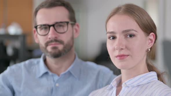 Close Up of Serious Young Couple Looking at the Camera 