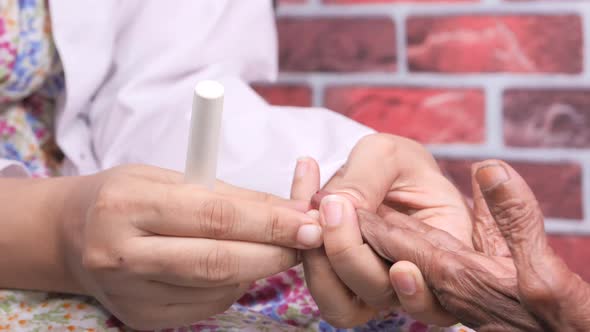 Women Doctor Measuring Diabetic of Senior Women