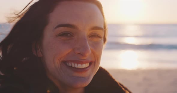 Woman using an vintage camera at the beach