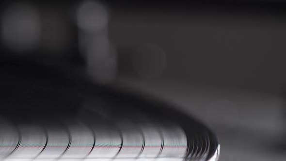 Male Hand Put Needle on Record Spinning on Turntable