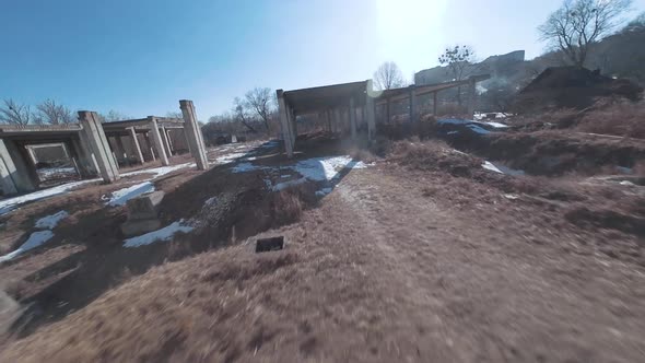 FPV Drone Flies Quickly and Maneuverably Among the Ruins of Industrial Buildings