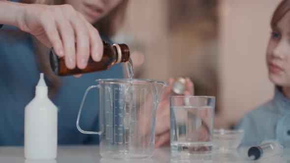 Making Sanitizer By Adding Ethanol To Cup