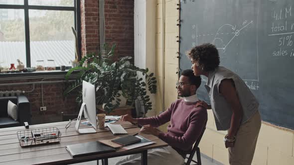 Office Workers Using Computer Together