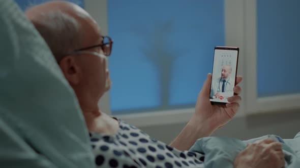 Old Patient with Disease Using Smartphone for Telemedicine