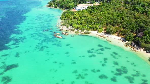 Aerial top view nature of idyllic shore beach adventure by shallow ocean and white sandy background 