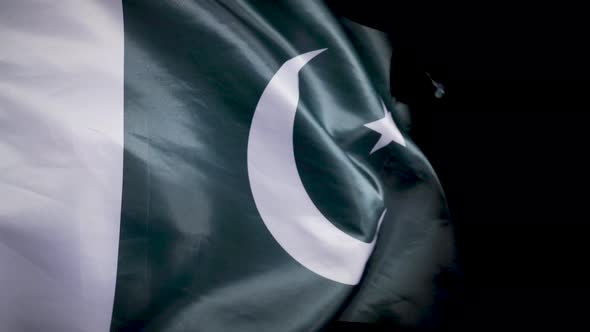 National Pakistan Flag. Black background. alt