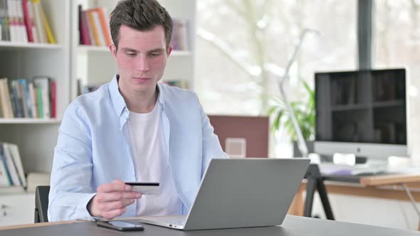 Failed Online Shopping By Young Man on Laptop