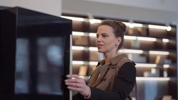 Beautiful Woman Opening Wardrobe Door with Excited Facial Expression