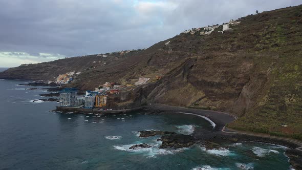 Tenerife, top view of the black volcanic sand beach near the hotels, Atlantic ocean