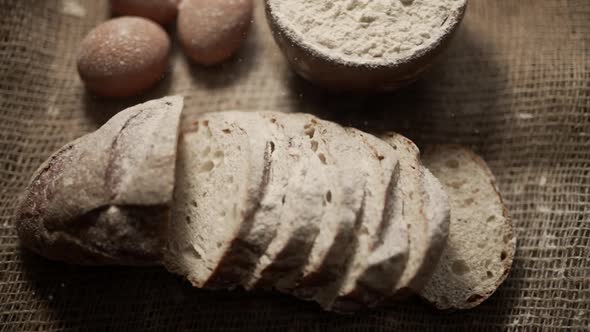 Close Up of Freshly Baked Bread with Eggs and Flour