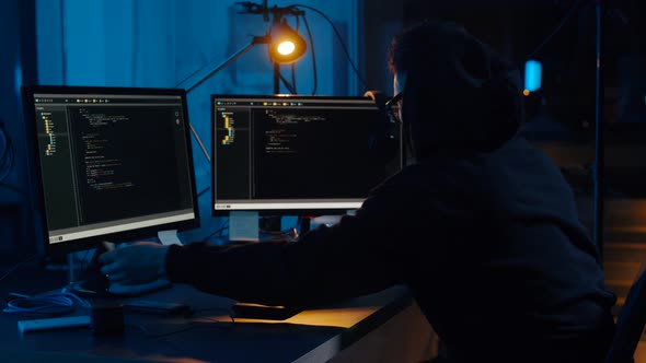 Hacker in Glasses Using Computers for Cyber Attack 41
