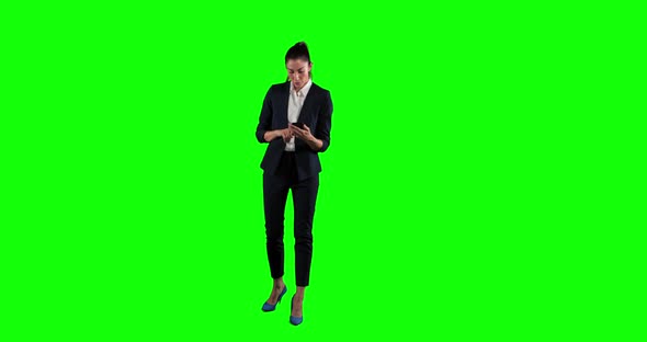 Animation of a Caucasian woman in suit walking and using a phone in a green background