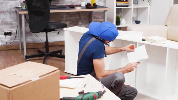 Male Worker Talking on the Phone Listening Instructions