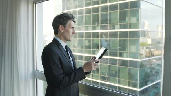 Businessman using digital tablet in office