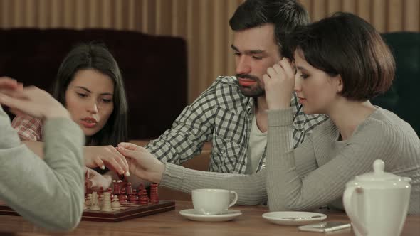 Friends Playing Chess Laughing Spending Holiday