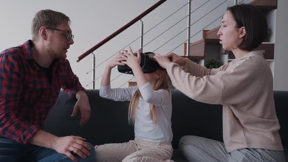 Little Girl Is Trying New Vr Glasses New Mother and Father