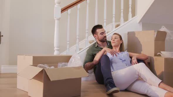 Caucasian attractive couple moving into new house