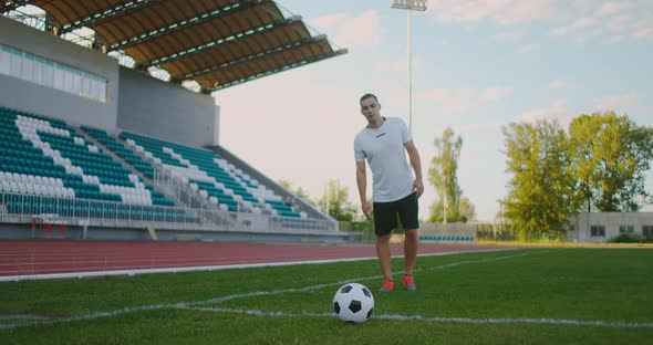 Soccer Player Performs Outstanding Play During a Soccer Game on a Professional Outdoor Soccer