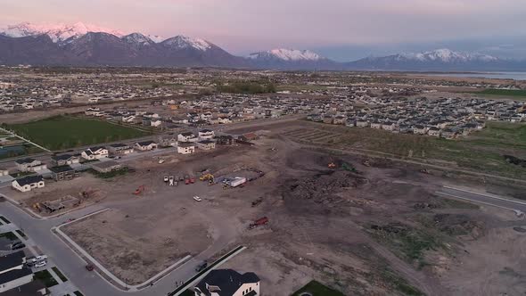 Aerial view over construction area for new homes in old farmland