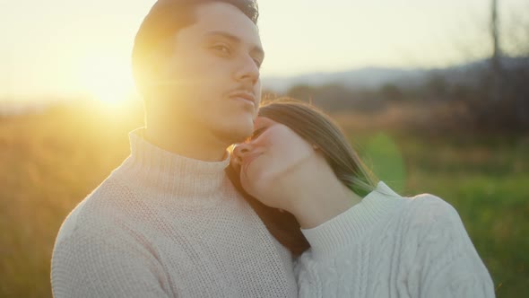 Couple embraces in the countryside