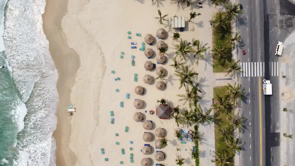 Aerial View of a Wonderful White Sand Beach with Waves Brushing on the Shore Road and Moving