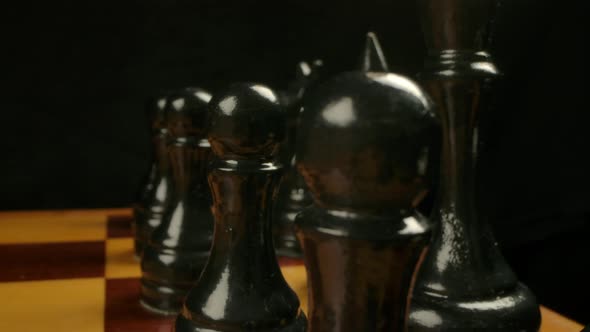 Dolly Camera Movement Behind Black Chess Pieces in Start Position