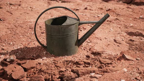 Beverage Can in Sand and Rocks Desert alt
