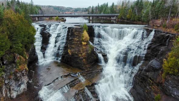 Cliff between two waterfalls with a bridge in Kaministiquia River, Kakabeka Falls, Ontario, Canada