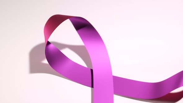 Beautiful shiny pink ribbon symbolizing breast cancer awareness. Moral support.