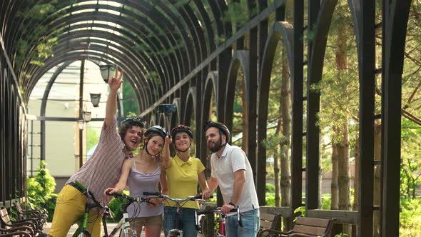 Four Young Cyclists Taking Selfie Outdoors