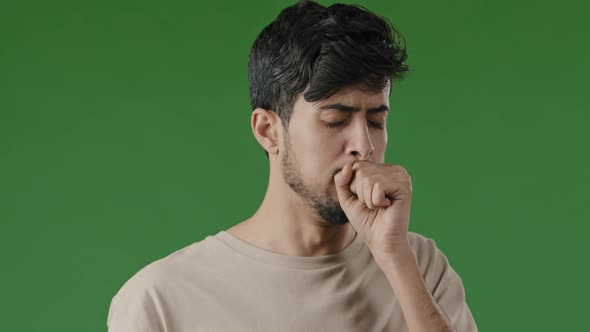 Portrait of Sick Sad Arabic Young Man Unhealthy Guy Suffering From Cough Sore Throat Covering Mouth