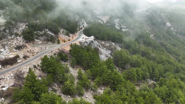 Foggy road in the mountains aerial view 4 K