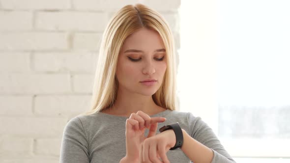 Young Woman Using  Smartwatch