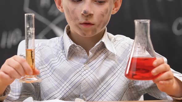 Confused Schoolboy Shrugging Shoulders, Dirty Face After Chemical Experiment
