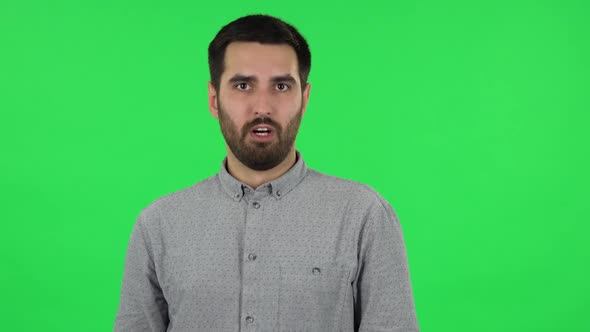 Portrait of Brunette Guy Is Saying Oh My God and Being Shocked. Green Screen