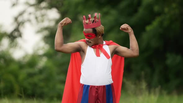 Hero man in red with crown and red mask standing