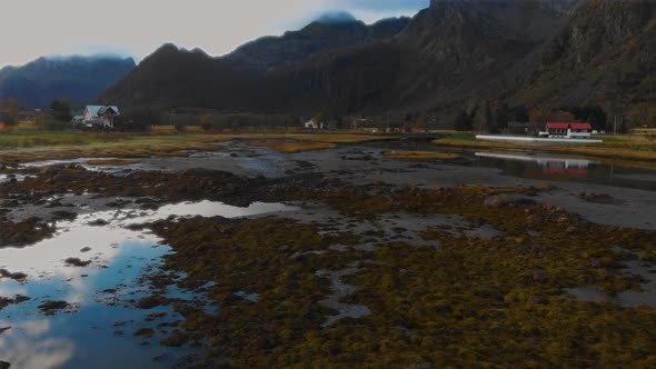 drone flying in norway at the shore. Looking slowly to the ground.