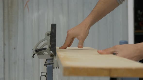 Carpenter using a joinery machine