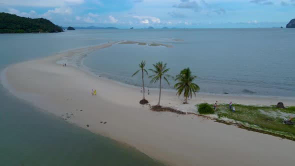 Couple Men and Women Walking on the Beach at the Island Koh Yao Yai Thailand Beach with White Sand