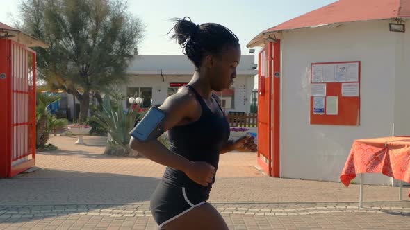 Attractive young black athlete running. Training, competition-slow motion