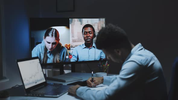 Mixed-race Colleagues Working Home on Quarantine By Making Common Video Call on a Big Monitor