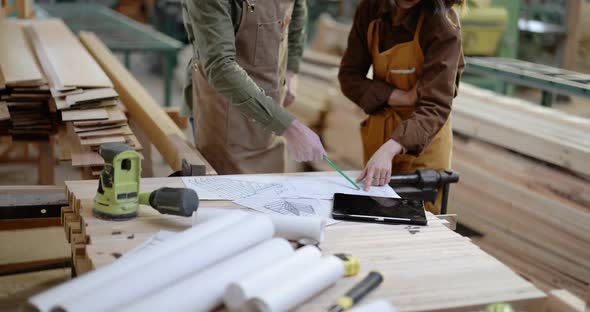 Carpentry Workers Designing at the Joinery