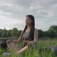 Young Asian Woman Was Sitting in Yoga in the Garden She Was Relaxed and Enjoyed the Workout - VideoHive Item for Sale