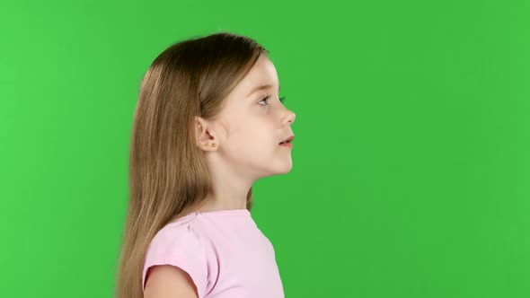 Baby Speaks Into a Shout. Green Screen. Side View