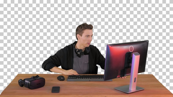 Nervous man watching video games on a PC computer, Alpha Channel