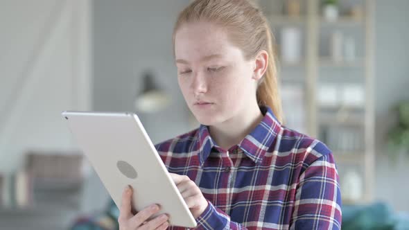 Close Up of Young Woman Using Tablet