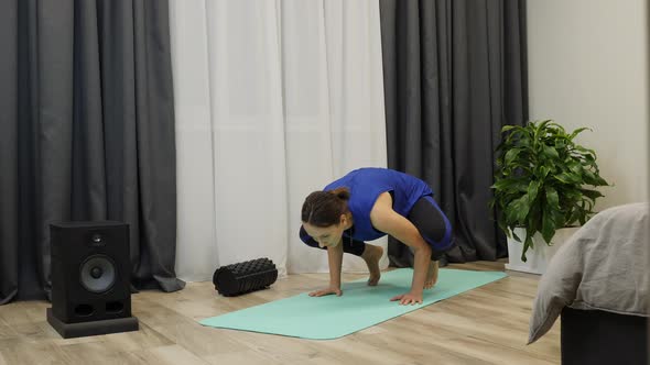 Yoga fail. Woman attempts crane or crow pose and falling down. Yoga concept