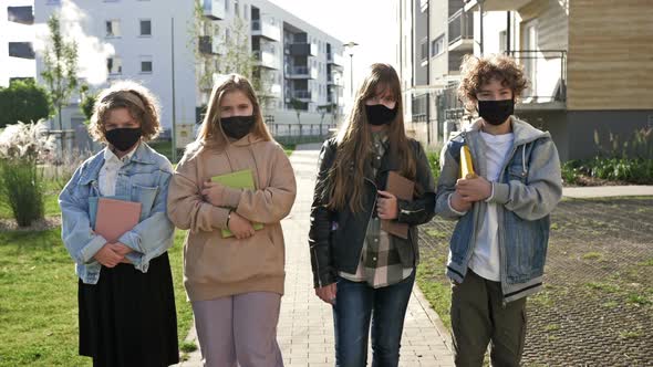 Group of Students Wearing Protective Masks. Academic Year Amid the Coronavirus Pandemic. Back To