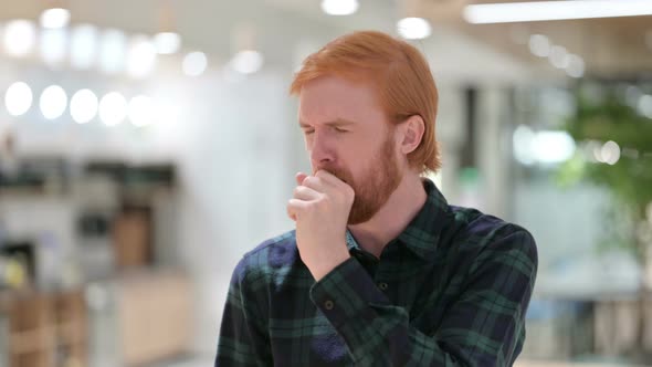 Portrait of Allergic Young Beard Redhead Man Coughing